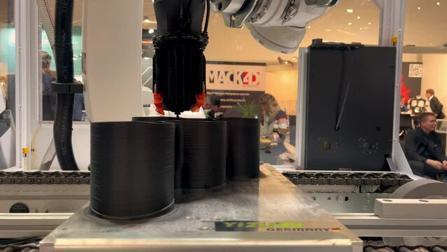 Industrial 3D Printer printing a big object part. Formnext event in Frankfurt, Germany. 