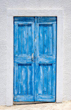Traditional blue painted wooden door of greek house
