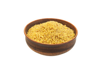 bulgur in a clay bowl on a white background. the concept of a good harvest of bulgur