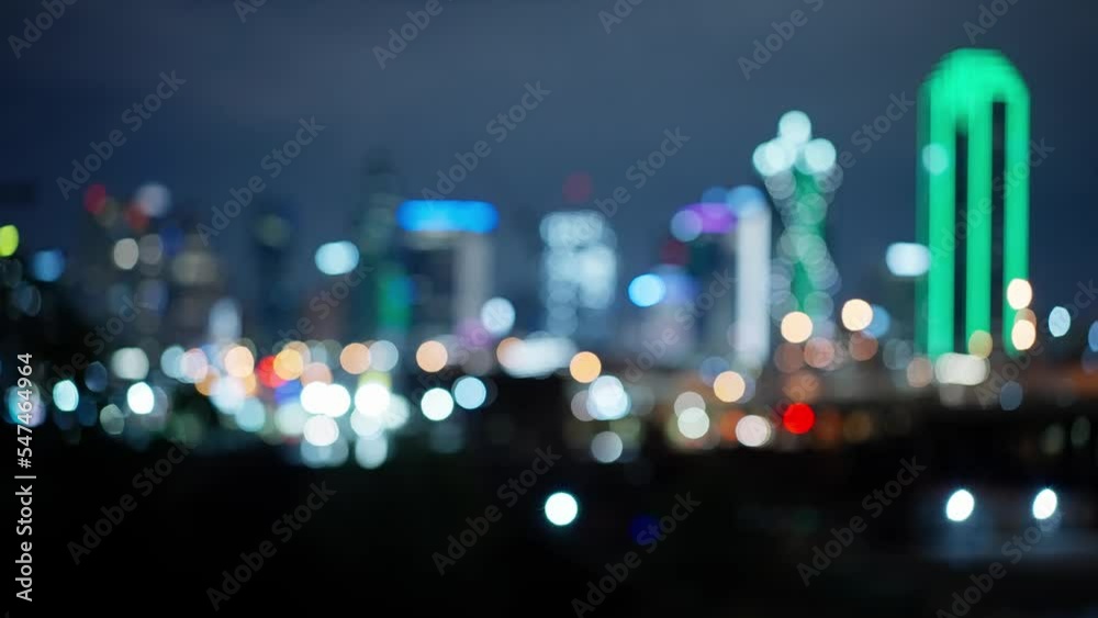 Poster Blurred background of Dallas Texas skyline by night - travel photography