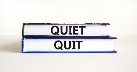 Quiet quit symbol. Concept words Quiet quit on books. Beautiful white table white background. Business and quiet quit concept. Copy space.