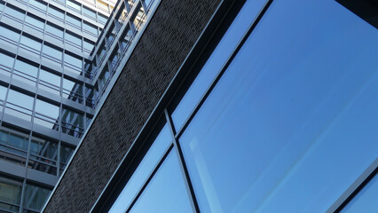 Fototapeta na wymiar Facade with glass panels of a skyscraper