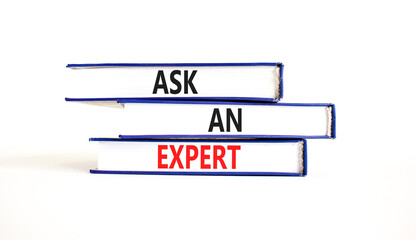 Ask an expert symbol. Concept words Ask an expert on books on a beautiful white table white background. Business and ask an expert concept. Copy space.