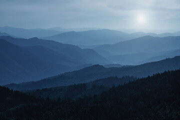 Naklejka premium Panorama of dark blue mountain landscape. Horizontal image.