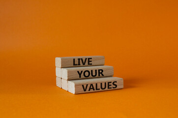 Live your values symbol. Concept words Live your values on wooden blocks. Beautiful orange...