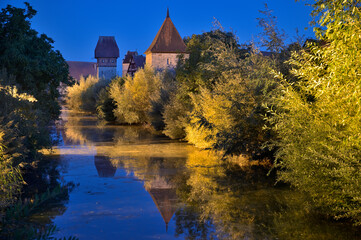 Blue hour in Dinkelsbühl with a view of the Bäuerlinsturm next to the Wörnitz in Bavaria, Germany, Europe