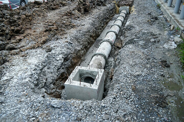 Construction site during laying or replacing underground sewer pipes Installation of plumbing,...