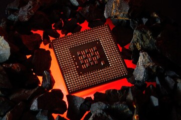 The microprocessor from the computer lies on hot coals. Close-up