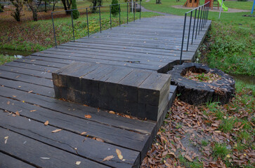 girder bridge over a stream or drainage ditch. design strong beams and subtle steel railing,...