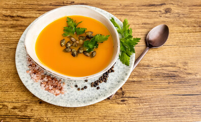 Pumpkin traditional soup with creamy  texture . Top view 