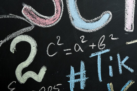 multi-colored chalk drawings on a slate wall.