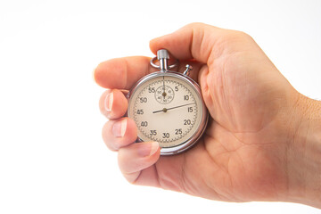 hand with a mechanical analog stopwatch on a white background. Time part precision. Measurement of the speed interval