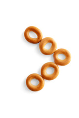 Symbol > bagel. Bagels font. Alphabet from set of small dry bagels isolated on white background. ABC symbols.