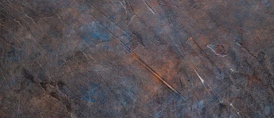 Dark abstract background of scratched surface. Faded paint texture. Grunge surface vintage backdrop