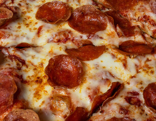 A pepperoni and cheese pizza up close