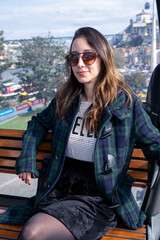 Fototapeta premium Young woman tourist in a cable car in Portugal