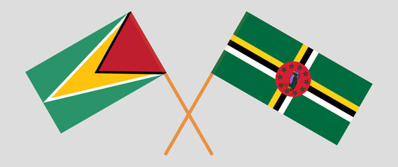 Crossed flags of Guyana and Dominica. Official colors. Correct proportion