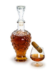 decanter with cognac, glass and cigar