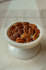 Walnut plan, pecan halves on a beautiful stand, Nuts are healthy.
