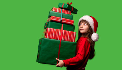 A girl in a Santa hat holds a lot of gifts for Christmas and New Year 2023. Happy childhood. Sale and Black Friday