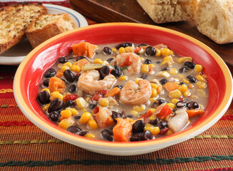 Bean and Shrimp Chowder in Bright Orange Bowl Horizontal
