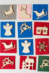 wooden christmas ornaments on paper tiles