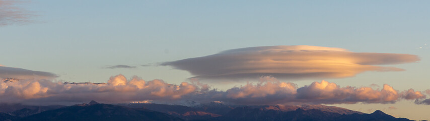 Lenticular clouds at sunset over the Sierra Nevada mountains (Spain)