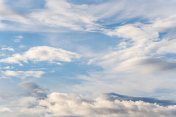 Fototapeta premium A beautiful blue autumn sky with white fluffy clouds makes for a fabulous overall view of the sky