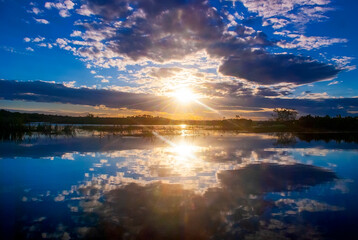 Fototapeta premium Pôr do sol no Rio Itaúnas (Paisagem) | Itaúnas river