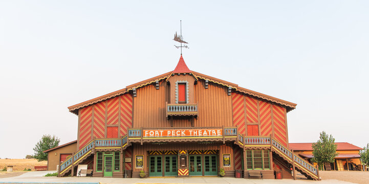 Fort Peck Theatre and Sign in Pseudo-Swiss-Chalet Style on September 7, 2022 in Fort Pack, Montana, USA