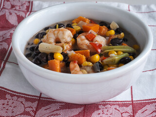 Bean and Shrimp Chowder in White Bowl Horz