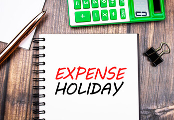 Expense holiday text concept on the background of the included light bulbs. Expense during holidays, counting expenses for vacations and holidays concept.