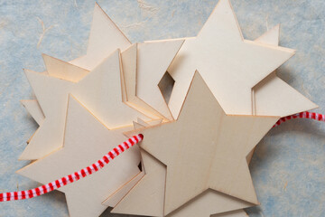 wooden stars and pipe cleaner on tissue paper