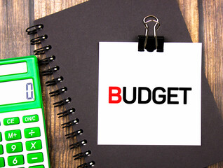 The word BUDGET next to the calculator on the table.Budget planning, expenses.Financial budget concept.