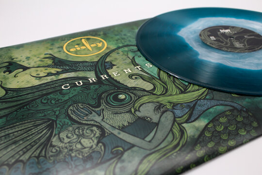 Indie rock band, Eisley, music album on vinyl record LP disc. Blue ocean like colored vinyl. Titled: Currents. Taken July 2, 2022 in Miami, FL