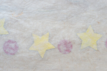tissue paper on yellow stars and red circles