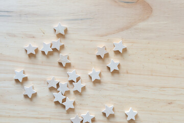 small wood stars on a wooden surface