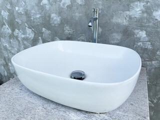 Modern bathroom washbasin with chrome faucet.