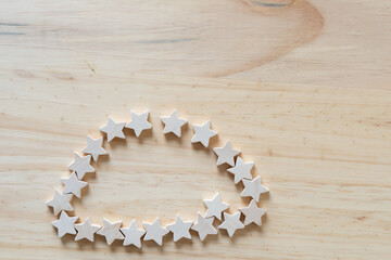 small wood stars on a wooden surface