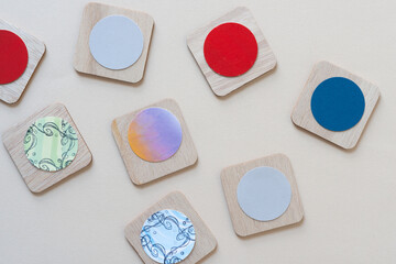 wood squares with rounded corners and paper discs
