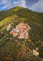 Fototapeta na wymiar A small village lavaggiorosso high up in the mountains near Levanto on the Ligurian coast. Secluded and almost forgotten it looks at us. Aerial drone picture. September 2021