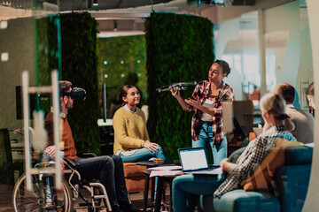 Business persons with a disability at work in modern open space coworking office on team meeting using virtual reality goggles.