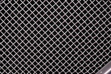A tightly woven crisscross stainless steel grid pattern, showcasing durability, strength, and industrial precision with a sleek metallic finish. stainless steel grid, crisscross metal, steel mesh, ind