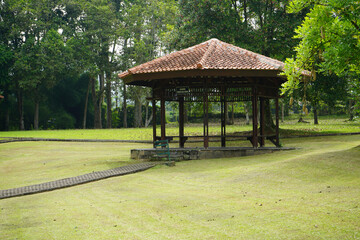 A gazebo for rest and shelter in a very large garden of grass and flowers. Thriving meadow. Taman Bunga Nusantara, Cianjur, West Java, Indonesia.