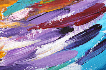 Beautiful strokes of colorful oil paints on white canvas as background, closeup