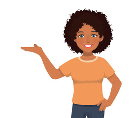 Happy young African woman with hand on waist showing presenting open hand palm with copy space for product advertisements