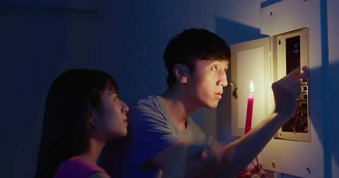 asian couple with power outage