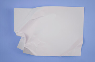 Abstract crumpled paper texture isolated in blue background