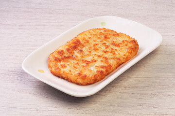 Hash browns on white plate 
