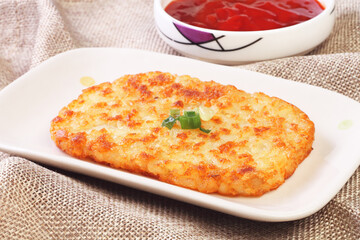 Hash browns on white plate 